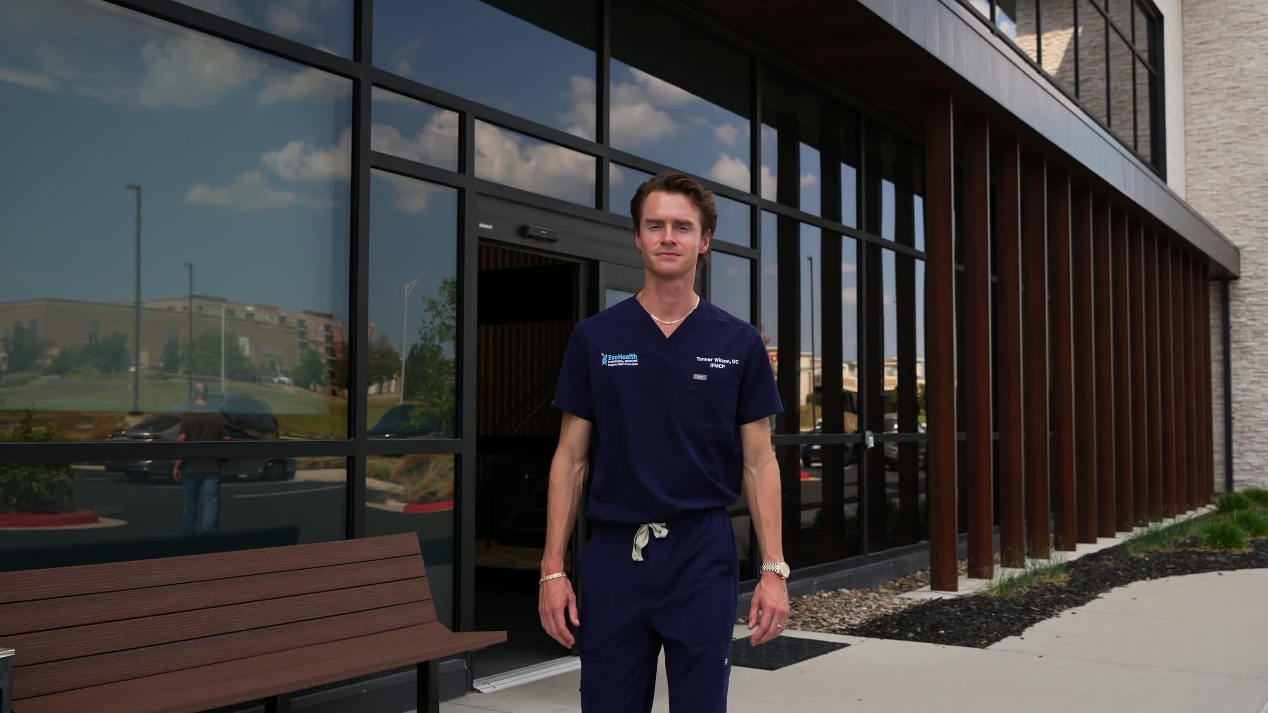 Tanner Wilson, DC, IFMCP outside the EvoHealth clinic on Metcalf Ave in Overland Park
